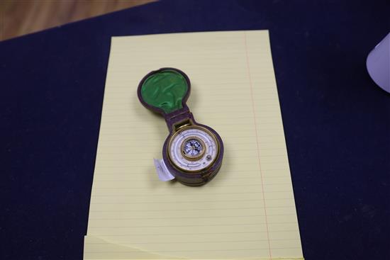 A late Victorian brass travelling barometer, thermometer and compass, cased